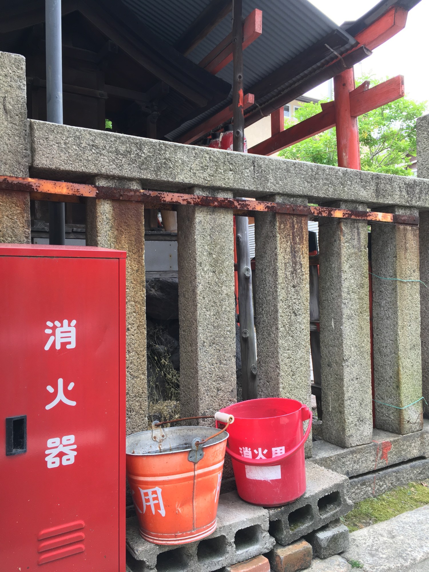 The fire extinguishers are sometimes accompanied by a red fire bucket, which are also frequently seen on their own. While the water may only quench a small fire, their bright presence is a constant reminder to be careful with this element.