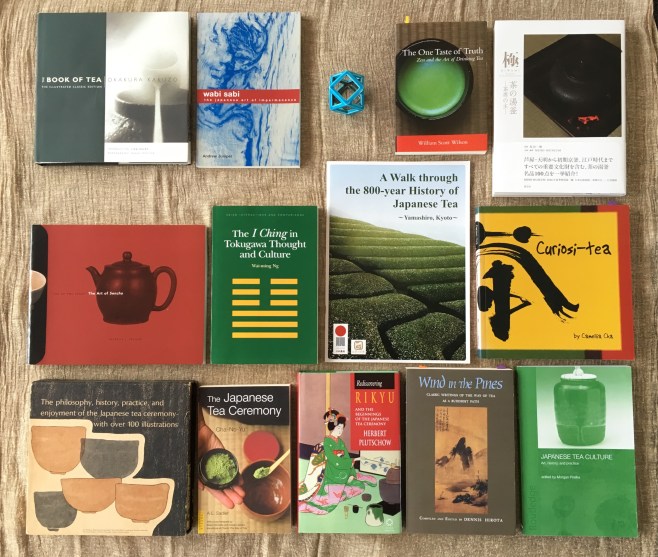 I have accumulated quite a few books on tea in my search for information about the elements. The four books specifically mentioned in the text can be seen here - Plutschow's book on Rikyu; the book on I Ching and the Art of Sencha, and Sadler's book on Cha-no-yu.The books sit on a beautiful hand scarf dyed with Japanese walnut that I bought in Ohara.The turquoise ceramic object is a Futaoki designed as a rest for the lid of the kettle or scoop (hishaku) used in the tea ceremony.